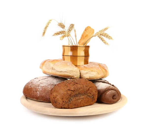 Different breads. Jar and tray of wood. Ears. — Stock Photo, Image