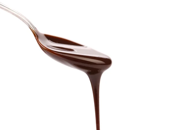从勺子漏出的巧克力糖浆 — 图库照片
