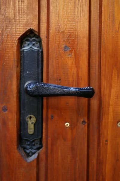 locking handle on the front wooden door