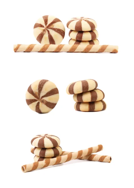 Striped chocolate wafer rolls and stake biscuits. — Stock Photo, Image