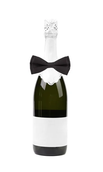 Černý motýlek na láhev šampaňského. — Stock fotografie