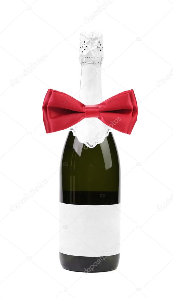 Bottle of champagne and red bow tie.