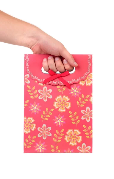 Red gift paper bag with flowers ptint. — Stock Photo, Image