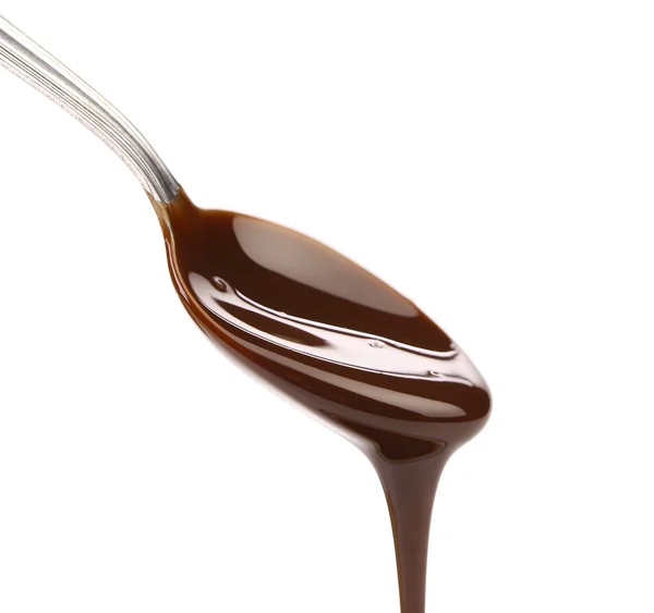 Liquid chocolate on a spoon. — Stock Photo, Image