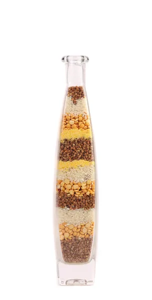 Bottiglia decorativa con semi colorati diversi . — Foto Stock