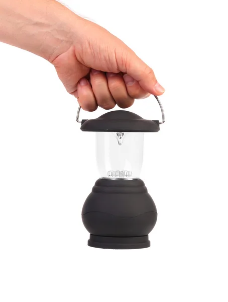 Hand holds camping lantern isolated on white — Stock Photo, Image