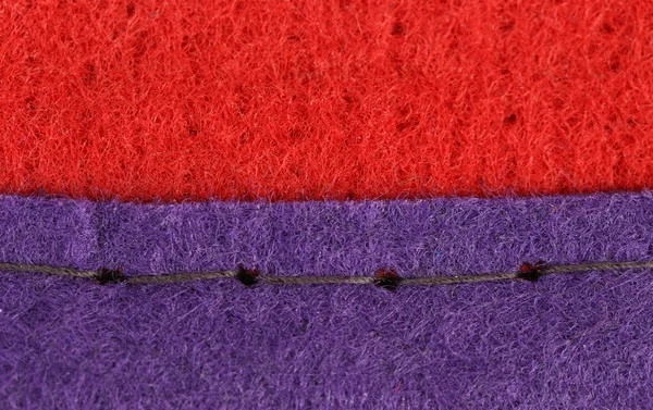 Join of red and blue fabric. — Stock Photo, Image