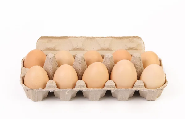 Ten brown eggs in egg box — Stock Photo, Image