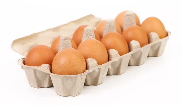 Ten brown eggs in egg box — Stock Photo, Image