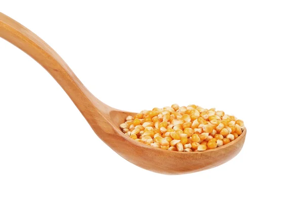 Corn grain into wooden spoon. — Stock Photo, Image