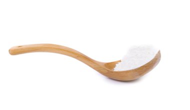Flour on a wooden spoon. Isolated clipart