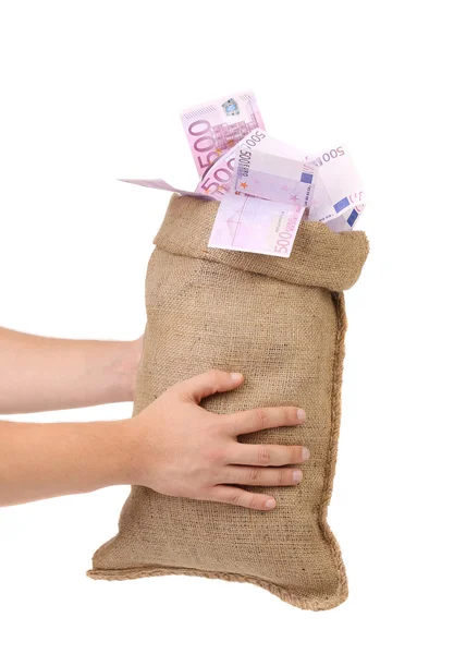 Manos de hombre sosteniendo bolsa de dinero llena con billetes en euros — Foto de Stock