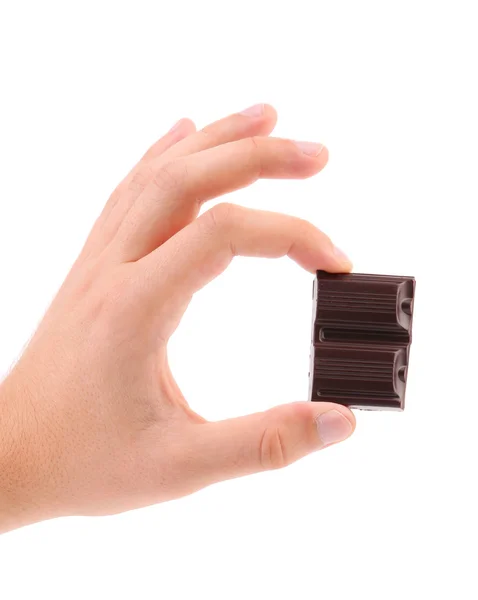 Hand houden twee stukken van chocolade — Stockfoto