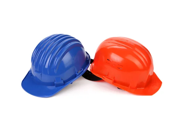 Hard hat of different colors like yin and yang. — Stock Photo, Image