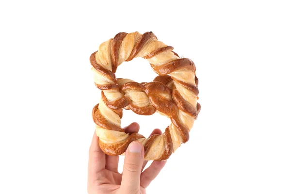 Hand holds knot-shaped biscuits — Stock Photo, Image