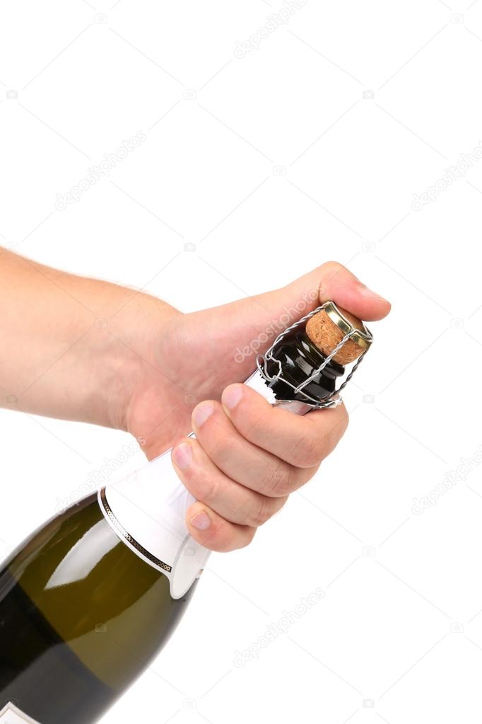 Hand with champagne bottle isolated