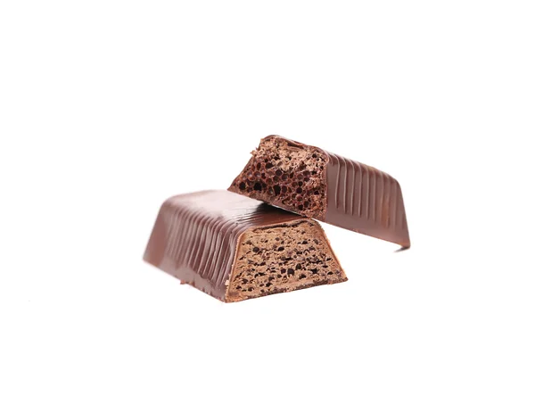 Broken bar of chocolate on a white background. — Stock Photo, Image