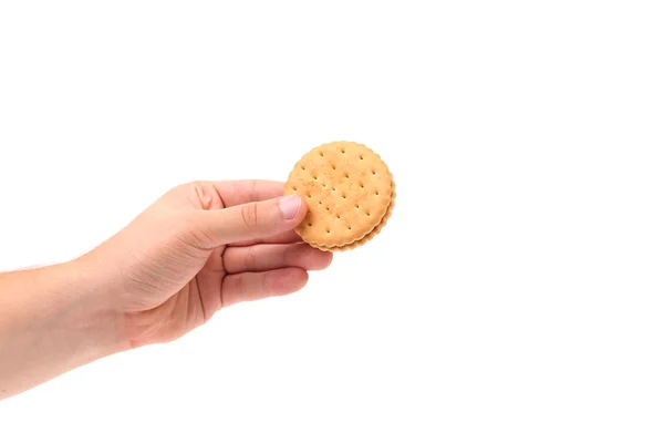 Hand holds cookie biscuits with filling — Stock Photo, Image