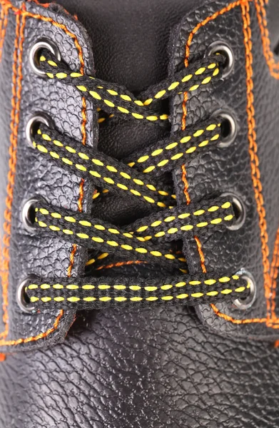 Black leather shoe laces in close-up. — Stock Photo, Image