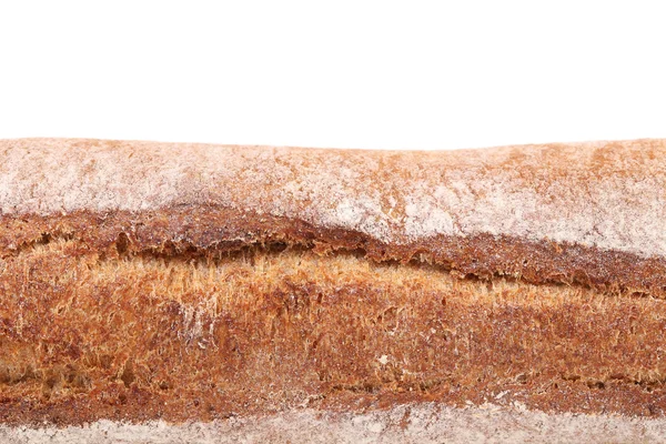 Loaf of black rye bread with flour — Stock Photo, Image