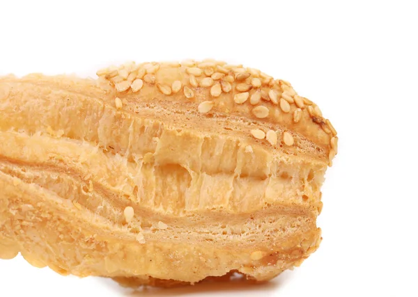 Piece of crunchy puff pastry with sesame. — Stock Photo, Image