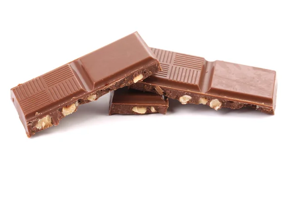 Tasty morsel of milk chocolate with nuts. — Stock Photo, Image