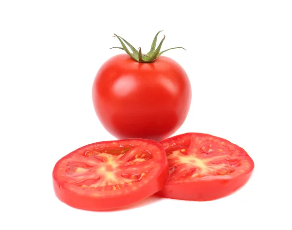 Fresh slices of tomato and entire potato — Stock Photo, Image