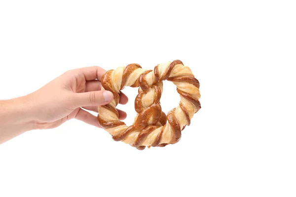Hand houdt knoop-vormige koekjes — Stockfoto