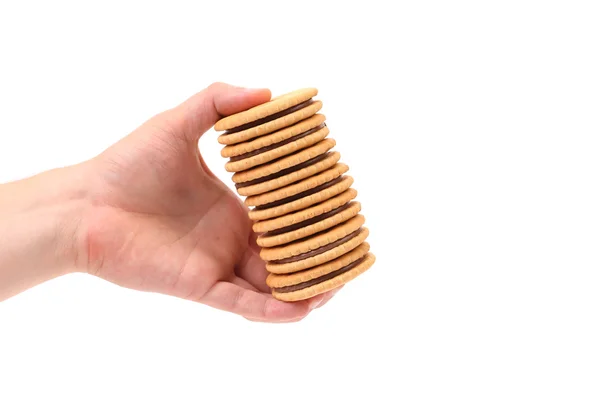 Hand holds closeup cookie biscuits with filling — Stock Photo, Image