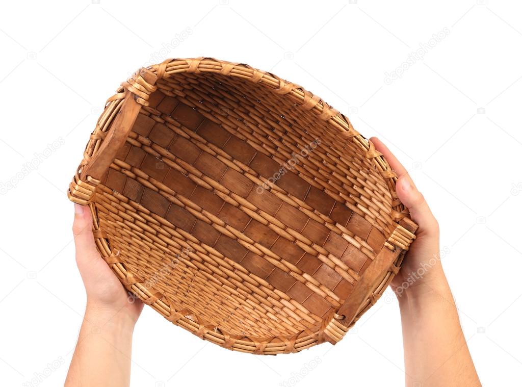 Hand holds vintage weave wicker basket