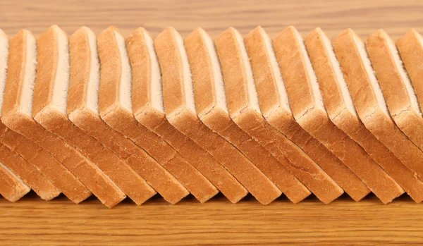 Rij van gesneden wheaten brood — Stockfoto