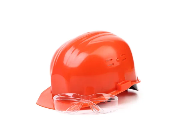 Red hard hat and glasses. — Stock Photo, Image