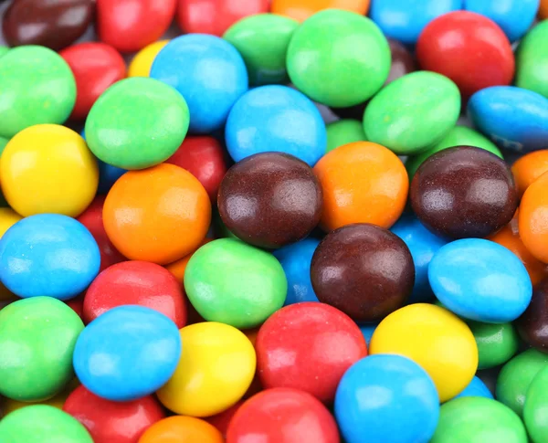 Background of chocolate balls in colorful glaze. — Stock Photo, Image
