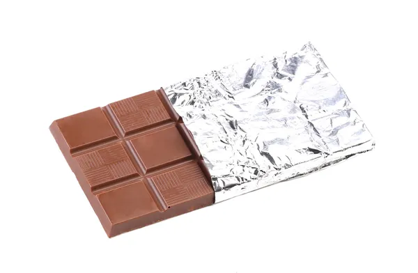 Bar of chocolate in foil. — Stock Photo, Image