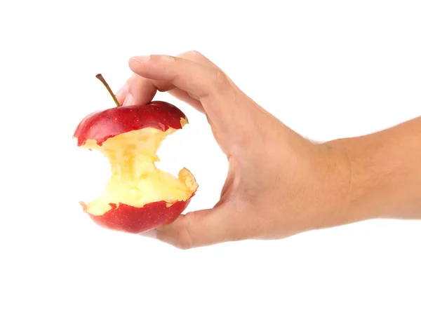 Hand holds core of an apple. — Stock Photo, Image