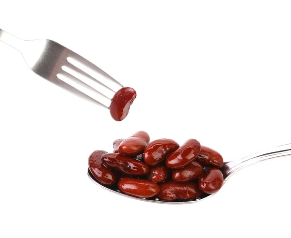 Kidney bean on a spoon and fork — Stock Photo, Image