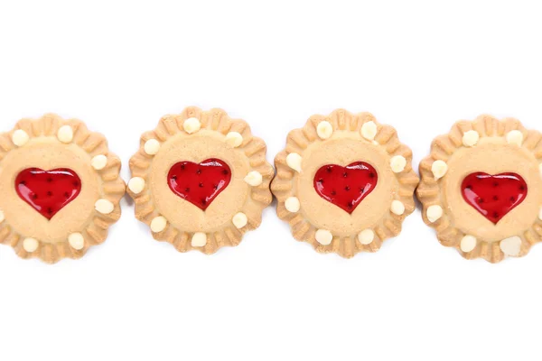 Fila de galletas de fresa en forma de corazón . — Foto de Stock