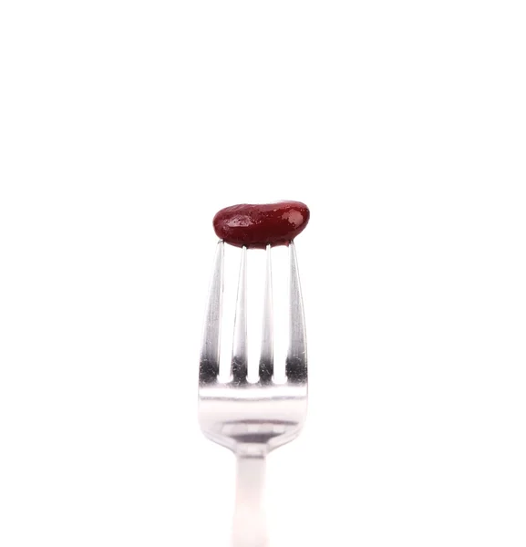Single canned bean on fork. — Stock Photo, Image