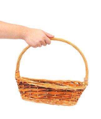 Hand holds wicker basket. clipart