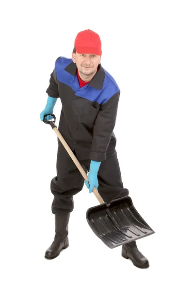 Worker holding black shovel. — Stock Photo, Image