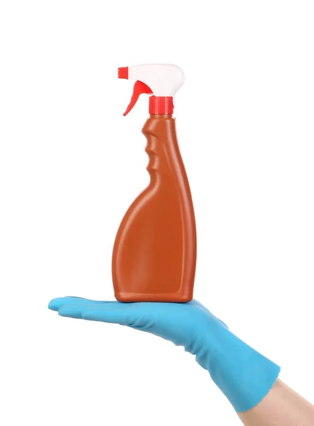 Hand in glove holding brown plastic spray bottle — Stock Photo, Image