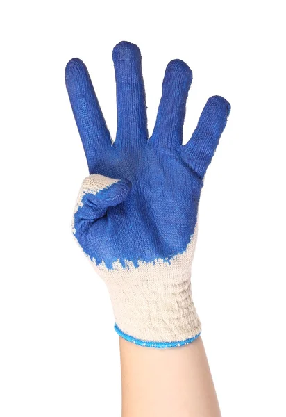 Hand zeigt vier in einem blauen Gummihandschuh — Stockfoto