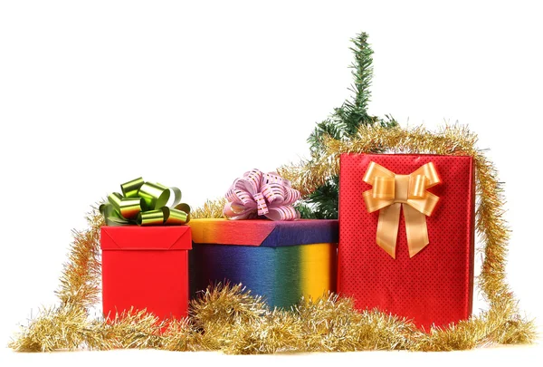 Gift boxes with christmas tinsel. — Stock Photo, Image