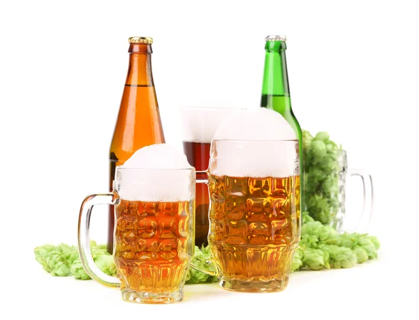 Two mugs of beer with foam and bottels — Stock Photo, Image