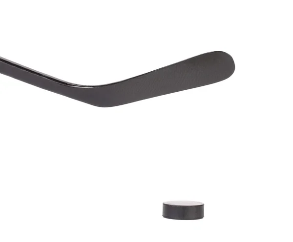 Black ice hockey stick a puk. — Stock fotografie