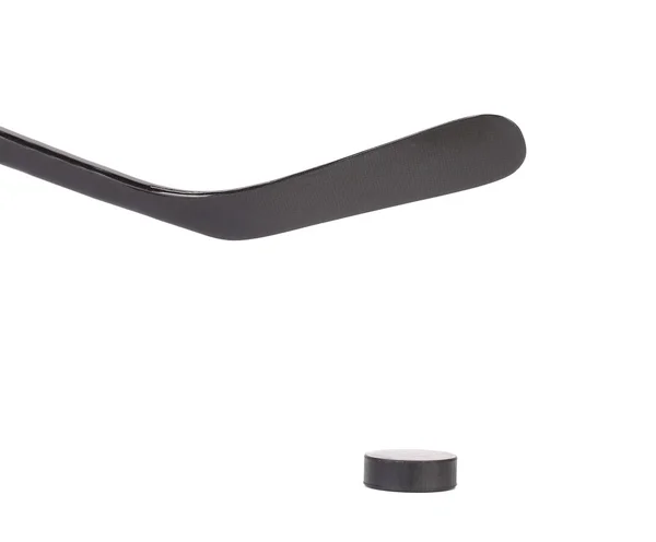 Black ice hockey stick and puck. — Stock Photo, Image