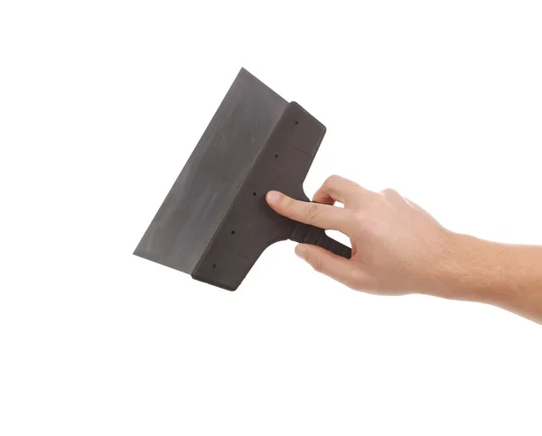 Hand holds construction spatula. — Stock Photo, Image