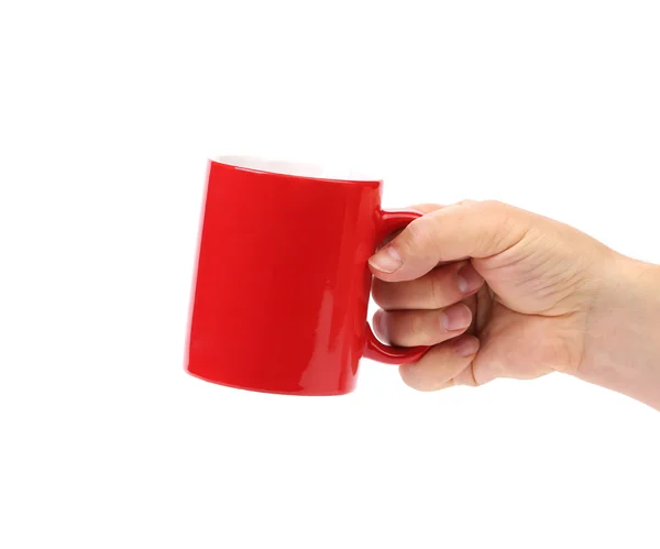 Ręka trzymać kubek czerwony na białym tle — Zdjęcie stockowe