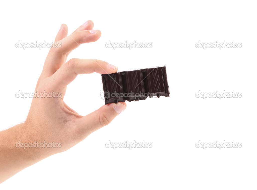 Hand hold three pieces of chocolate