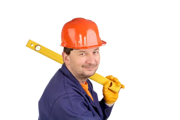 Worker in hard hat holding ruler — Stock Photo, Image